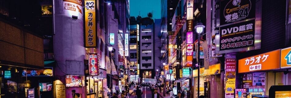 people walking on the streets surrounded by buildings