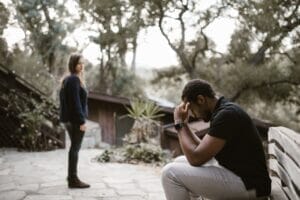 woman looking at the stressed man